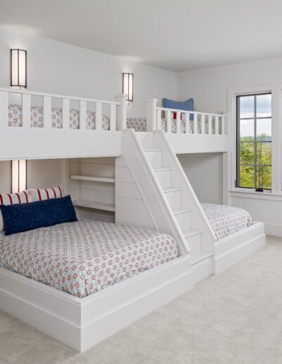 A white bedroom with a bunk bed.