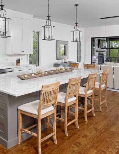A large kitchen with hardwood floors and a large island.