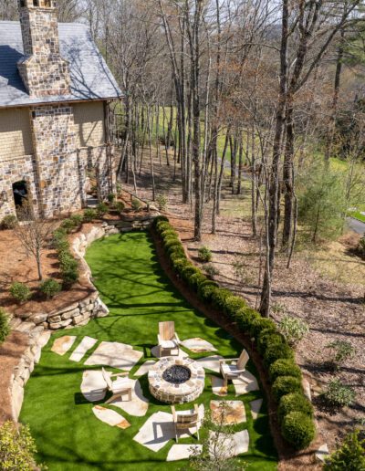 An aerial view of a home with a large lawn.