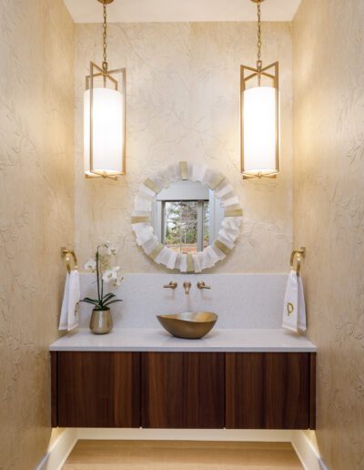 A bathroom with a sink and a mirror.