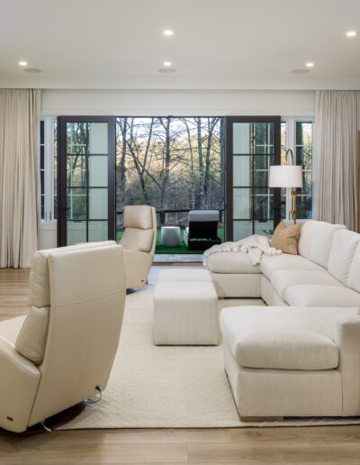 A living room with a large flat screen tv.